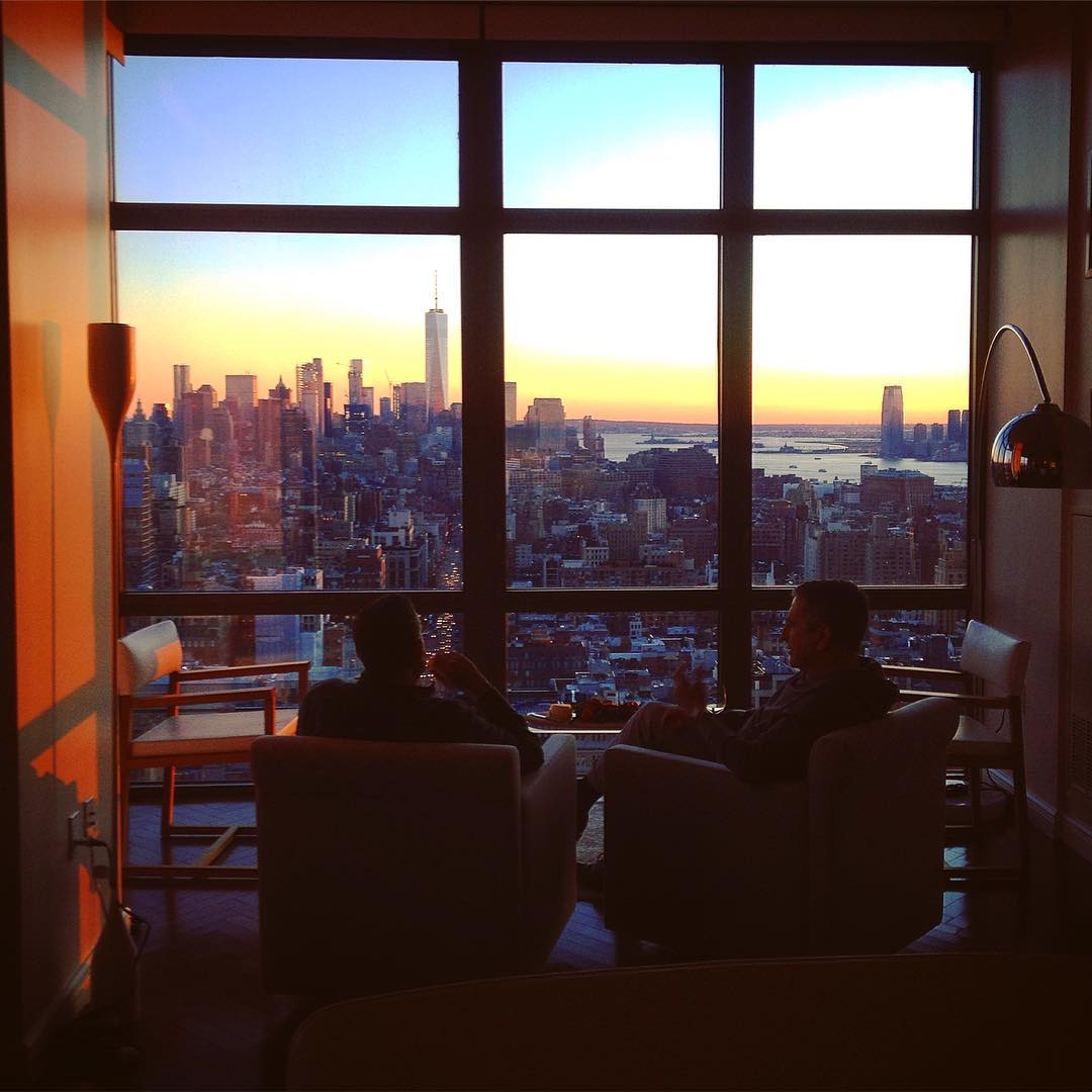 men watching NYC sunfall