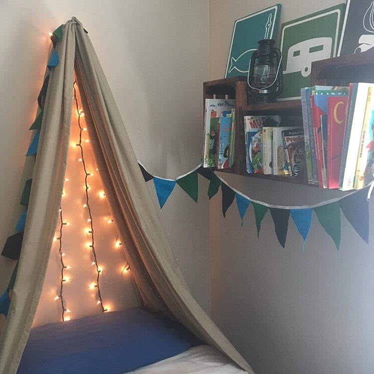 Bed with blanket tent and fairy lights