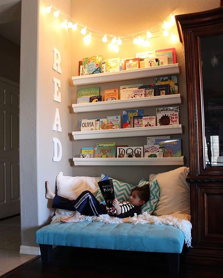 Child reading in shelved corner