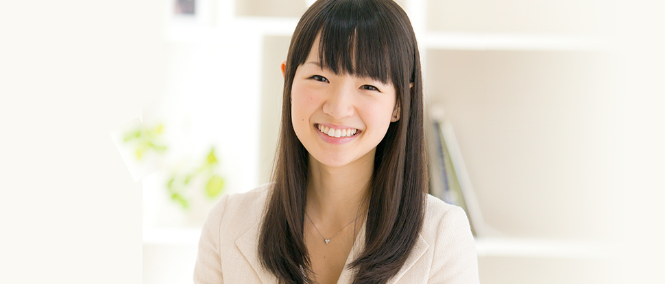 Marie Kondo sitting at a table