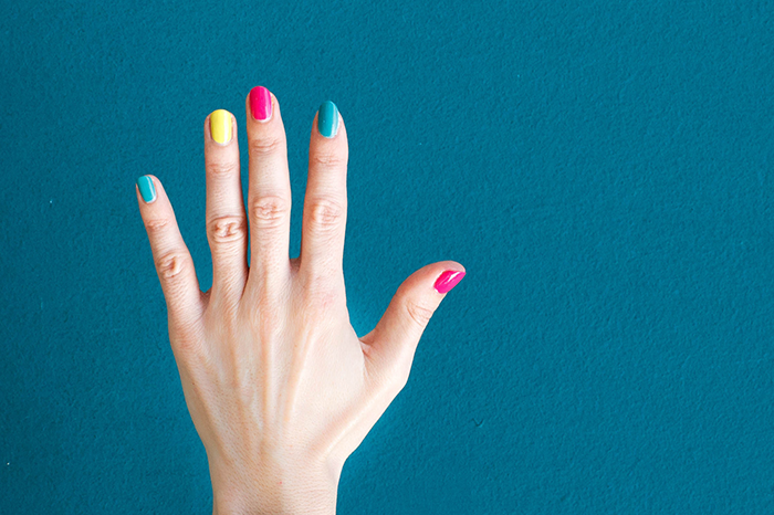 Hand with colourful nails