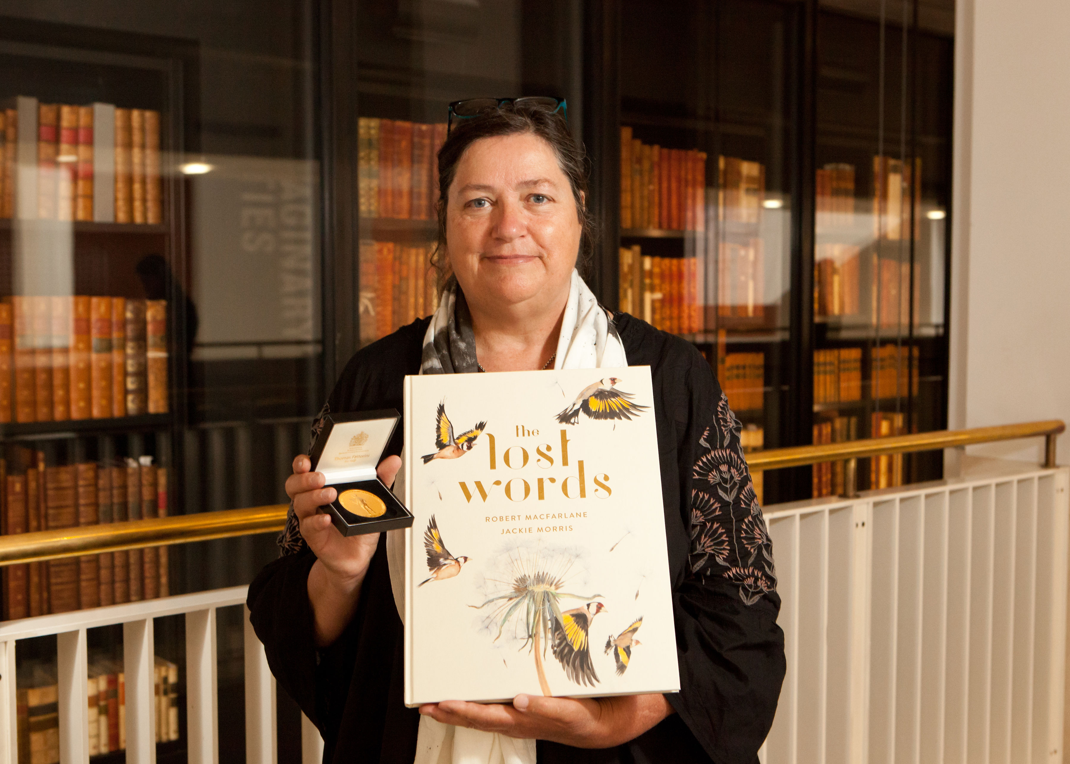 Jackie Morris with her book 'The Lost Words' and the CILIP Kate Greenaway Medal