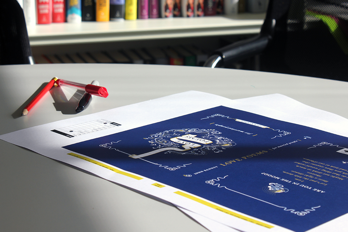 Possible design for book laid out on table with pen and pencil