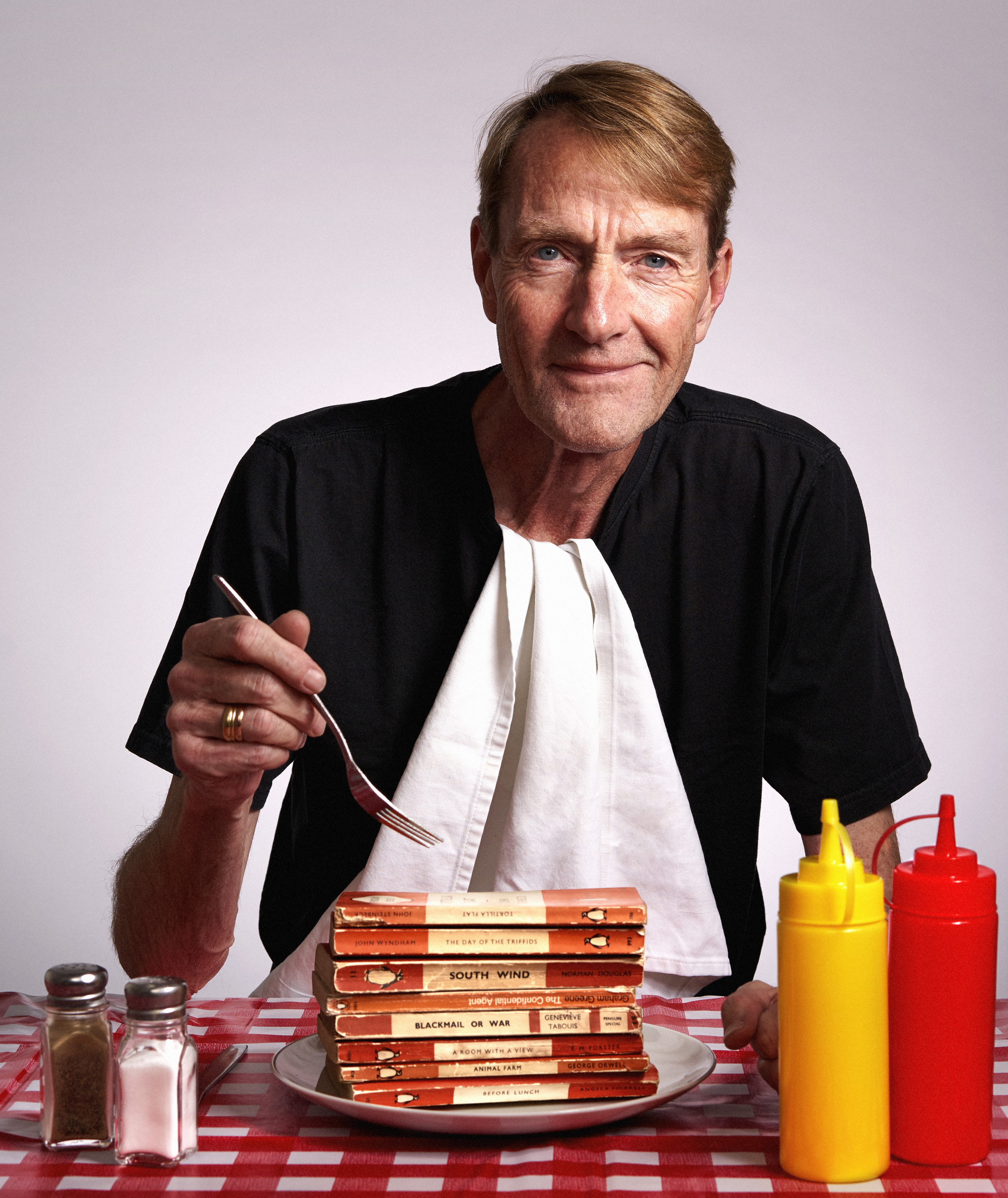 Lee Child with a balanced meal. Photo: Stuart Simpson for Penguin 2019