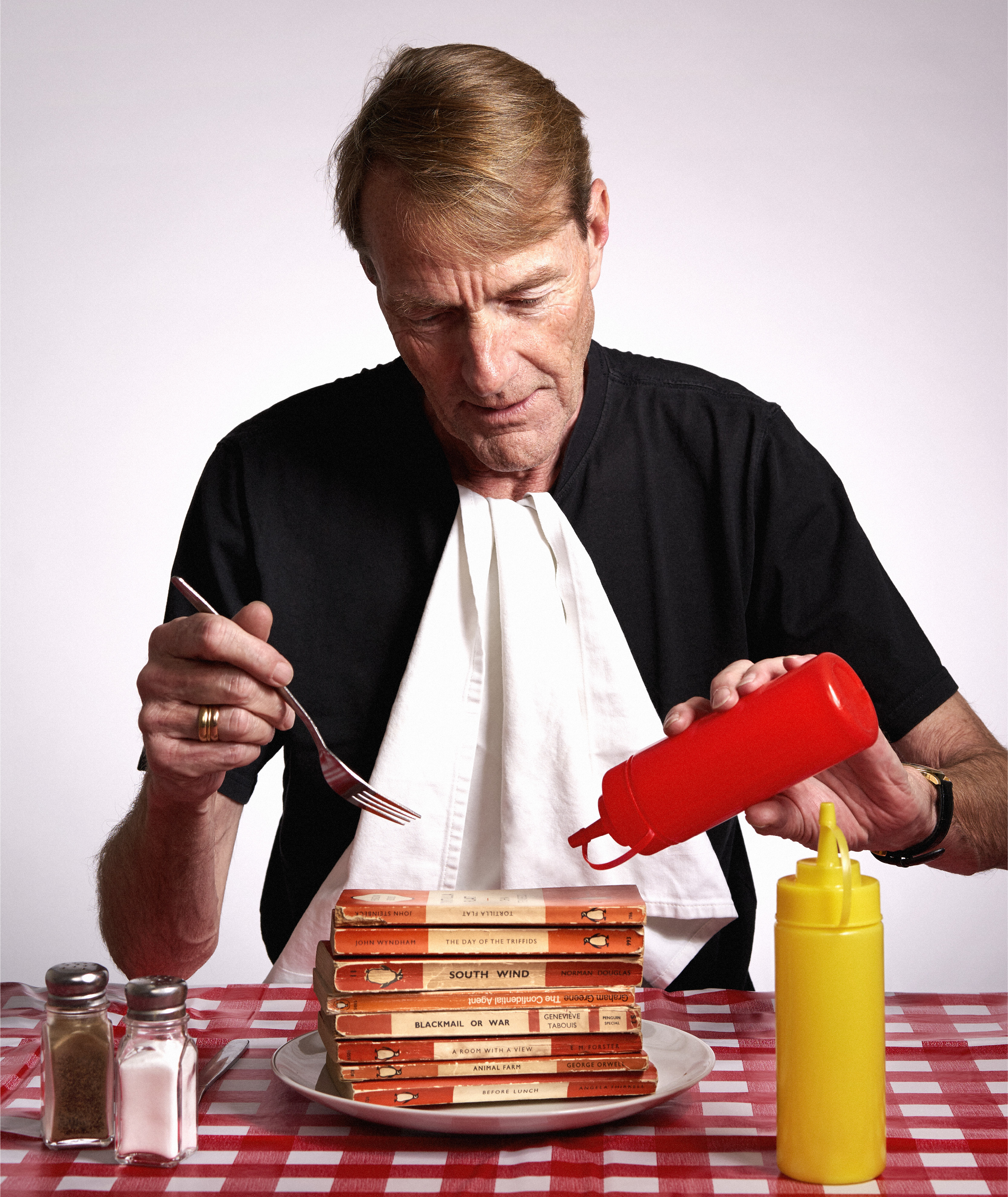 Lee Child with a balanced meal. Photo: Stuart Simpson for Penguin 2019