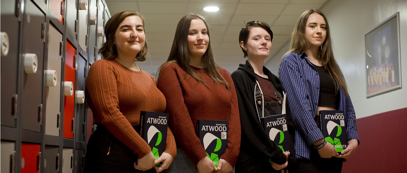 Four students from a secondary school in Salford pose for a photo