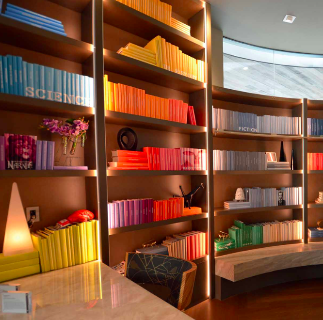 Colour-coded bookshelves, according to Wine, are fun and sometimes easier to recall where a book is