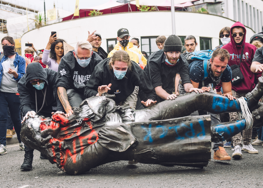 Protestors with the toppled statue of Edward Colston in Bristol. Image: Giulia Spadafora/NurPhoto via Getty Images