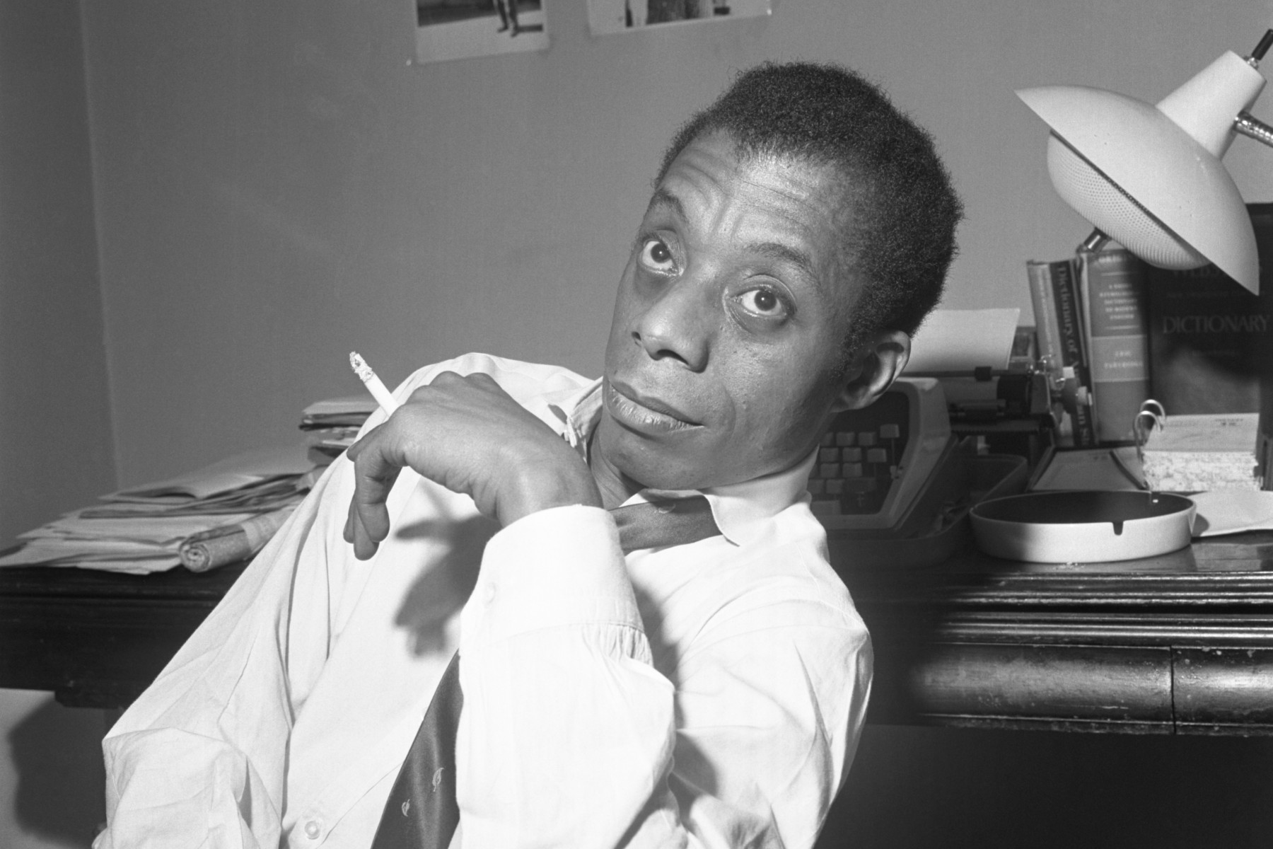 Baldwin, essayist and author of 'Notes of a Native Son', smoking a cigarette in 1963.