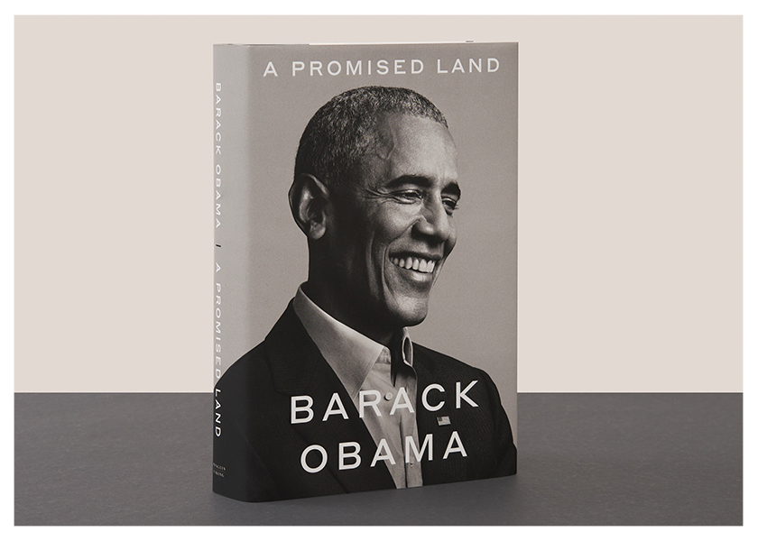 Photograph of the hardback edition of Barack Obama's A Promised Land on a grey and cream background.