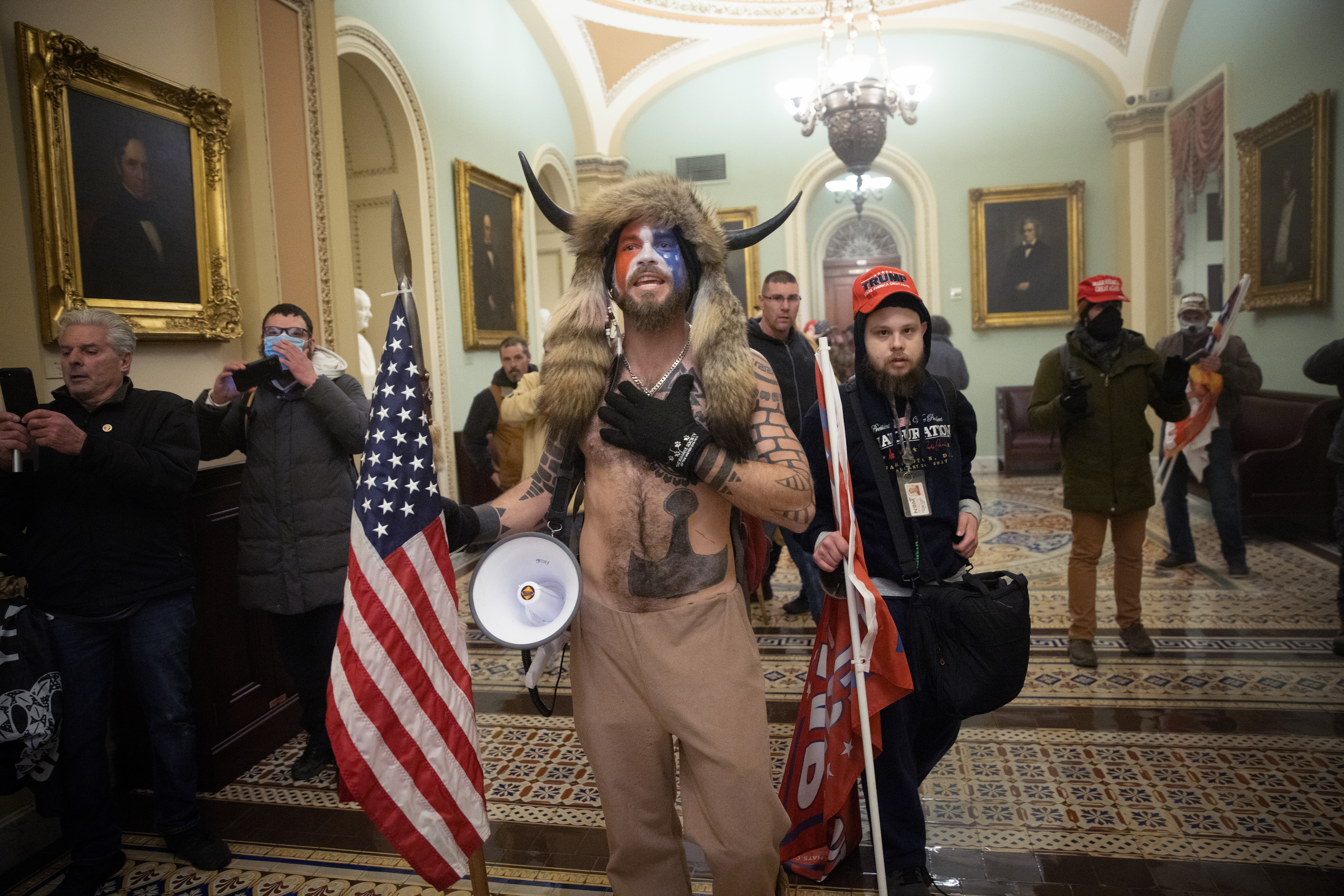 A pro-Trump mob confronts U.S. Capitol police outside the Senate chamber of the U.S. Capitol Building on January 06, 2021