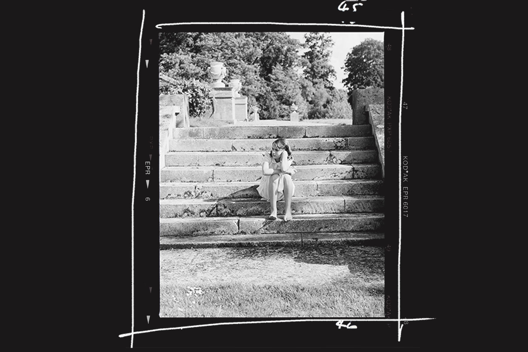 The model posing as Bryony sitting on the steps