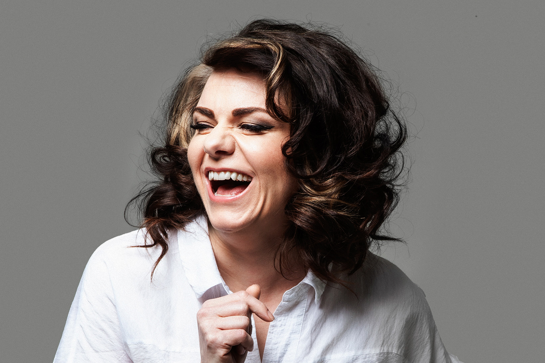 A photo of author Caitlin Moran laughing