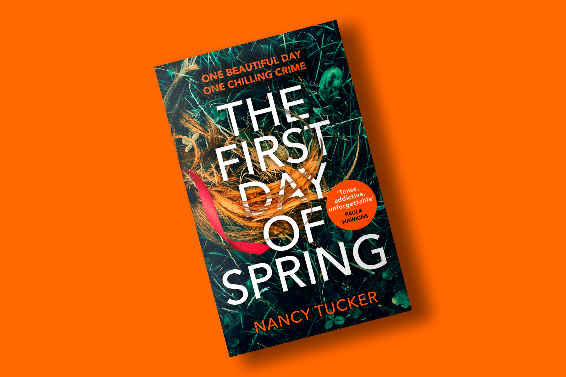 A bright orange background, with a hardback book at the centre. Book has a dark grass green cover, with auburn hair laid over. Text in white reads 'The First Day Of Spring'