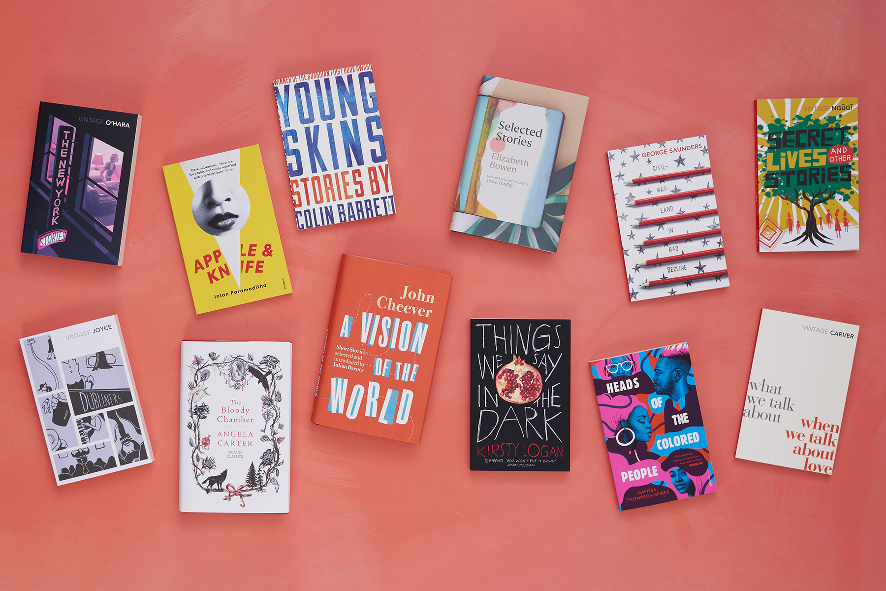 A host of short story collections photographed against a red background