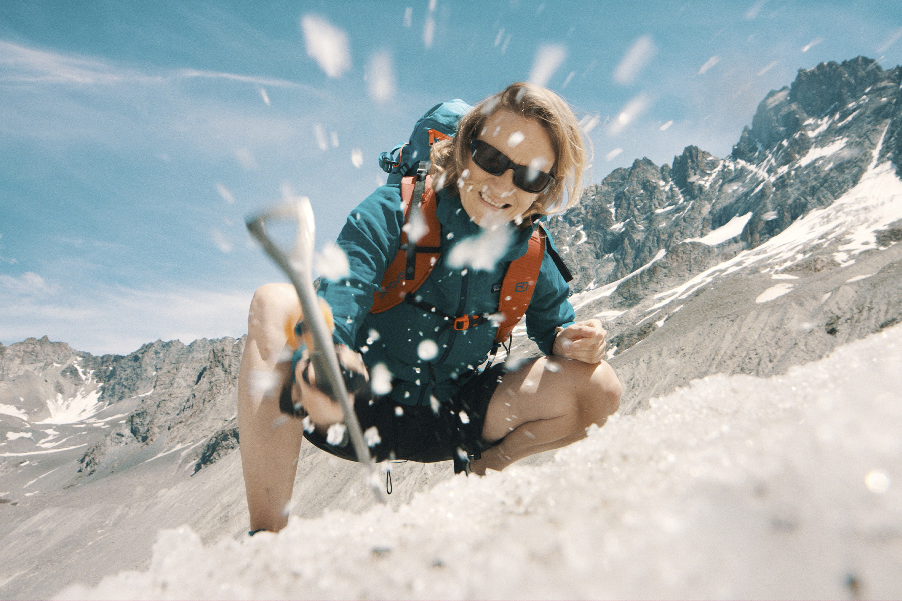 A photograph of Jemma Wadham climbing a mountain