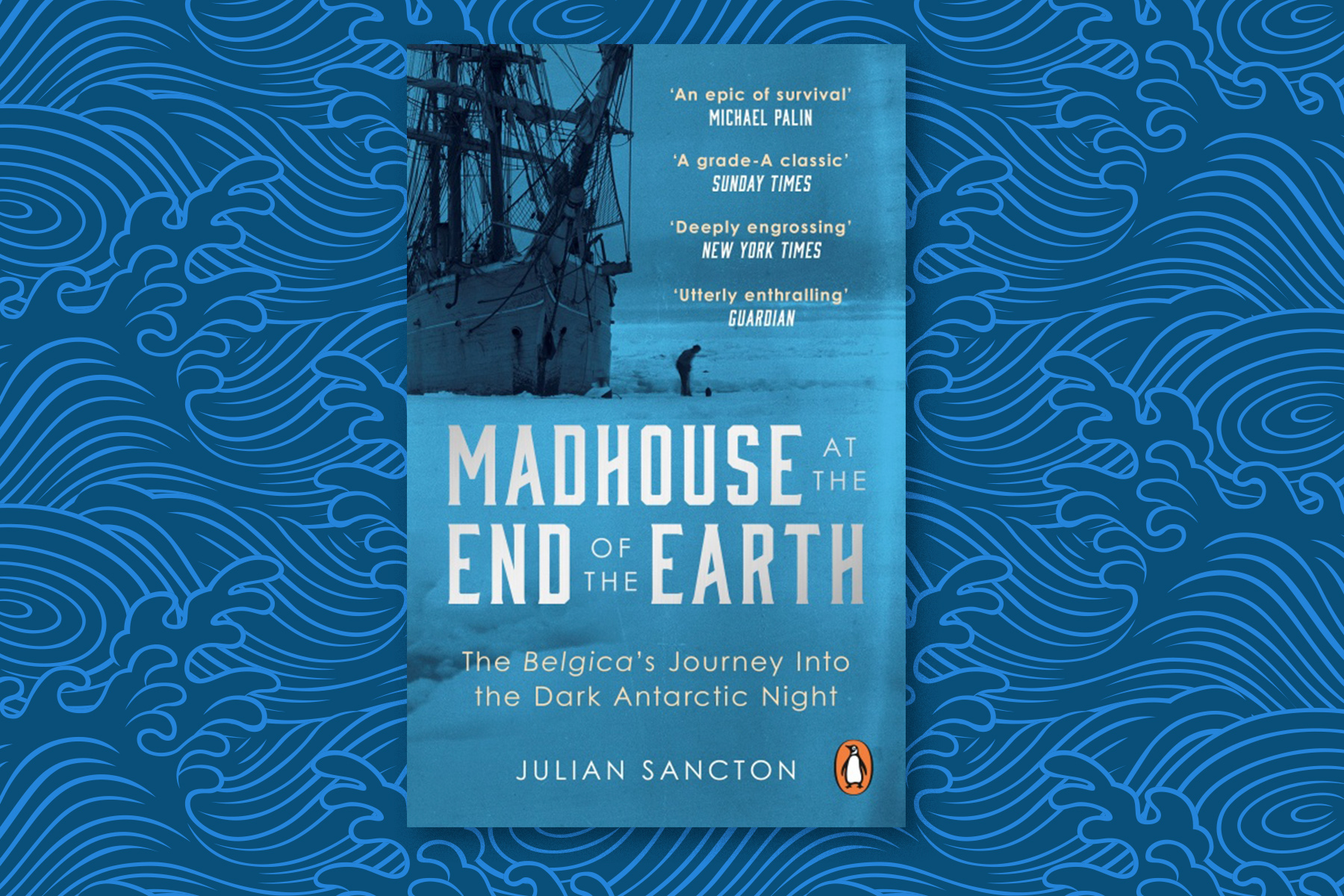 Julian Sancton's book, 'Madhouse at the End of the Earth', laid against a blue, ocean-like background