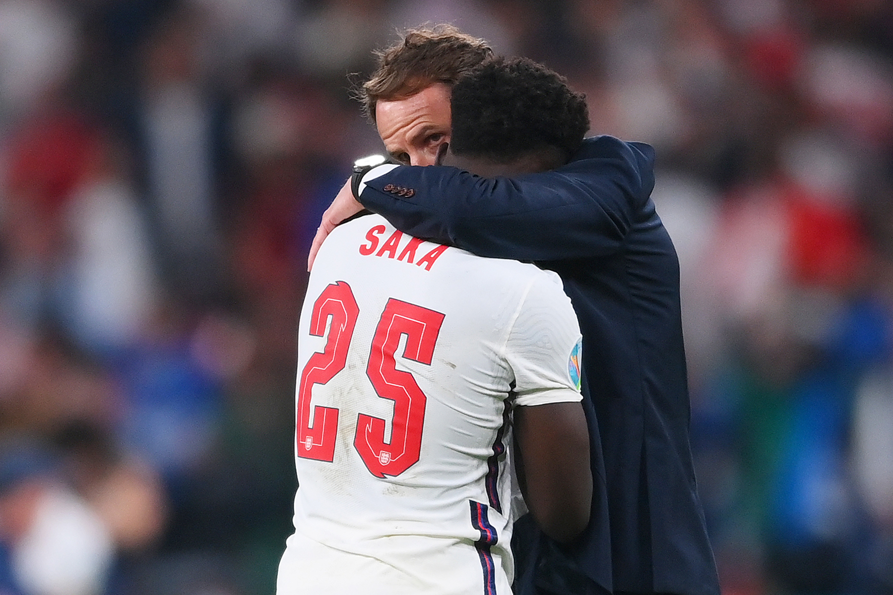 A photograph of Gareth Southgate consoling Bukayo Saka after the Euro 2020 final