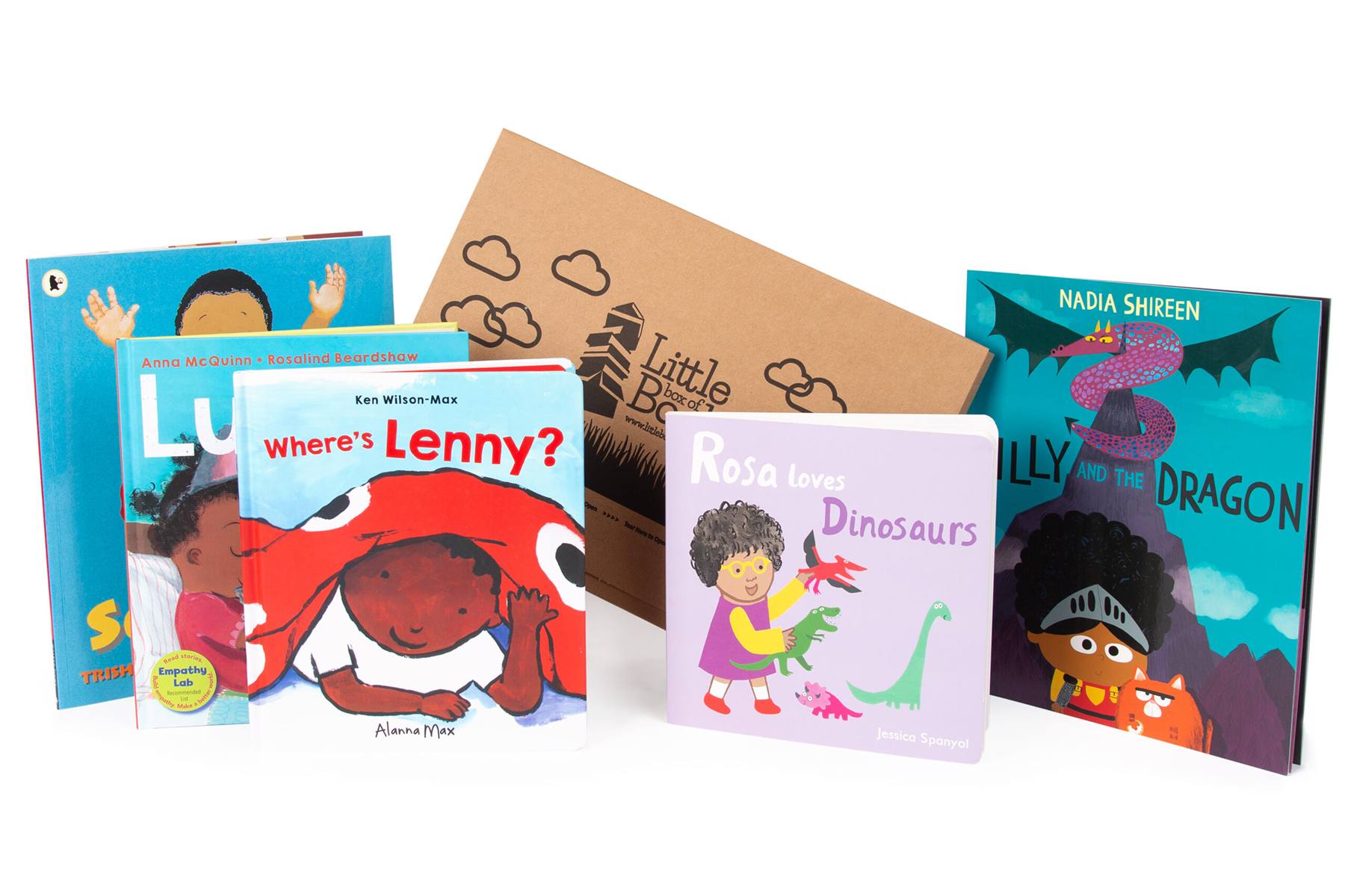 A photo of a selection of books included in the Little Box of Books subscription; they are all standing up against a white background