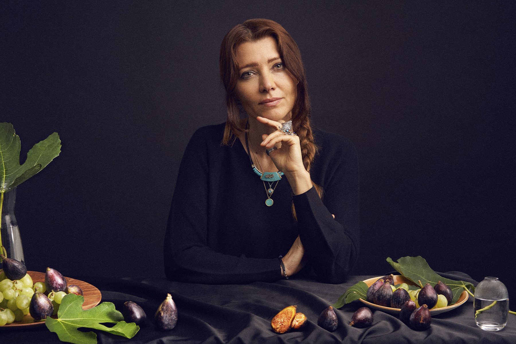 A portrait of Elif Shafak with fig trees