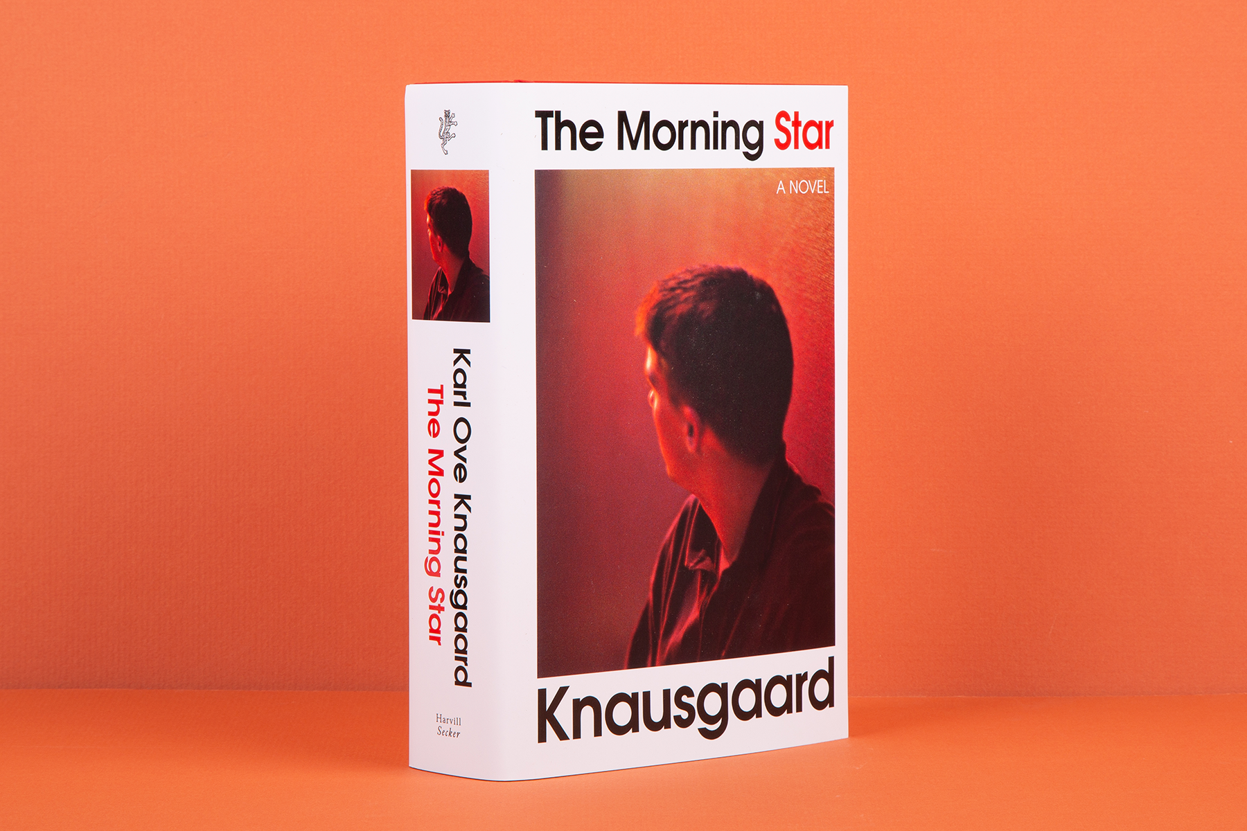 A photograph of Karl Ove Knausgaard's 'The Morning Star' against an orange background.