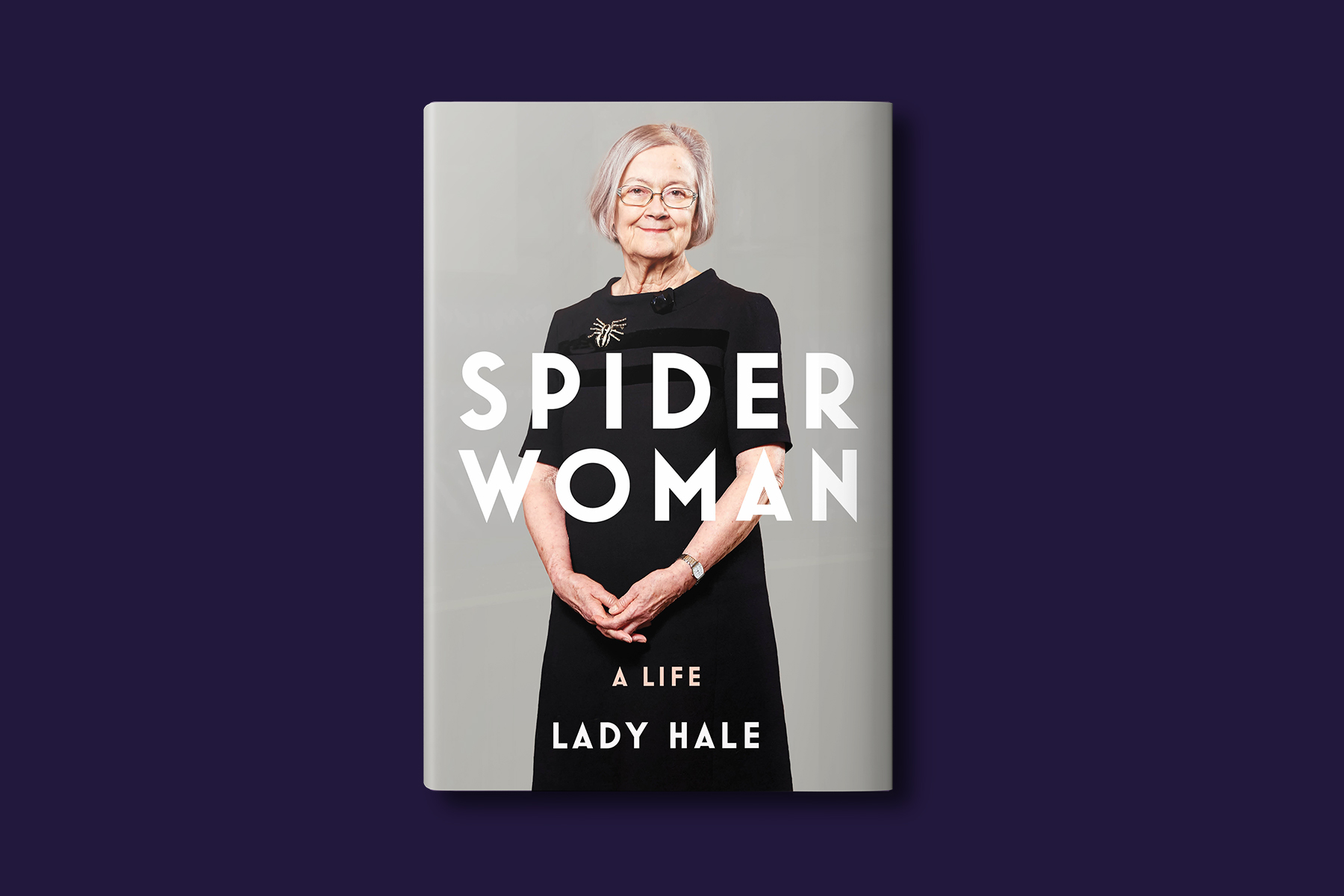 A photo of Lady Hale's memoir 'Spider Woman' against a purple background.