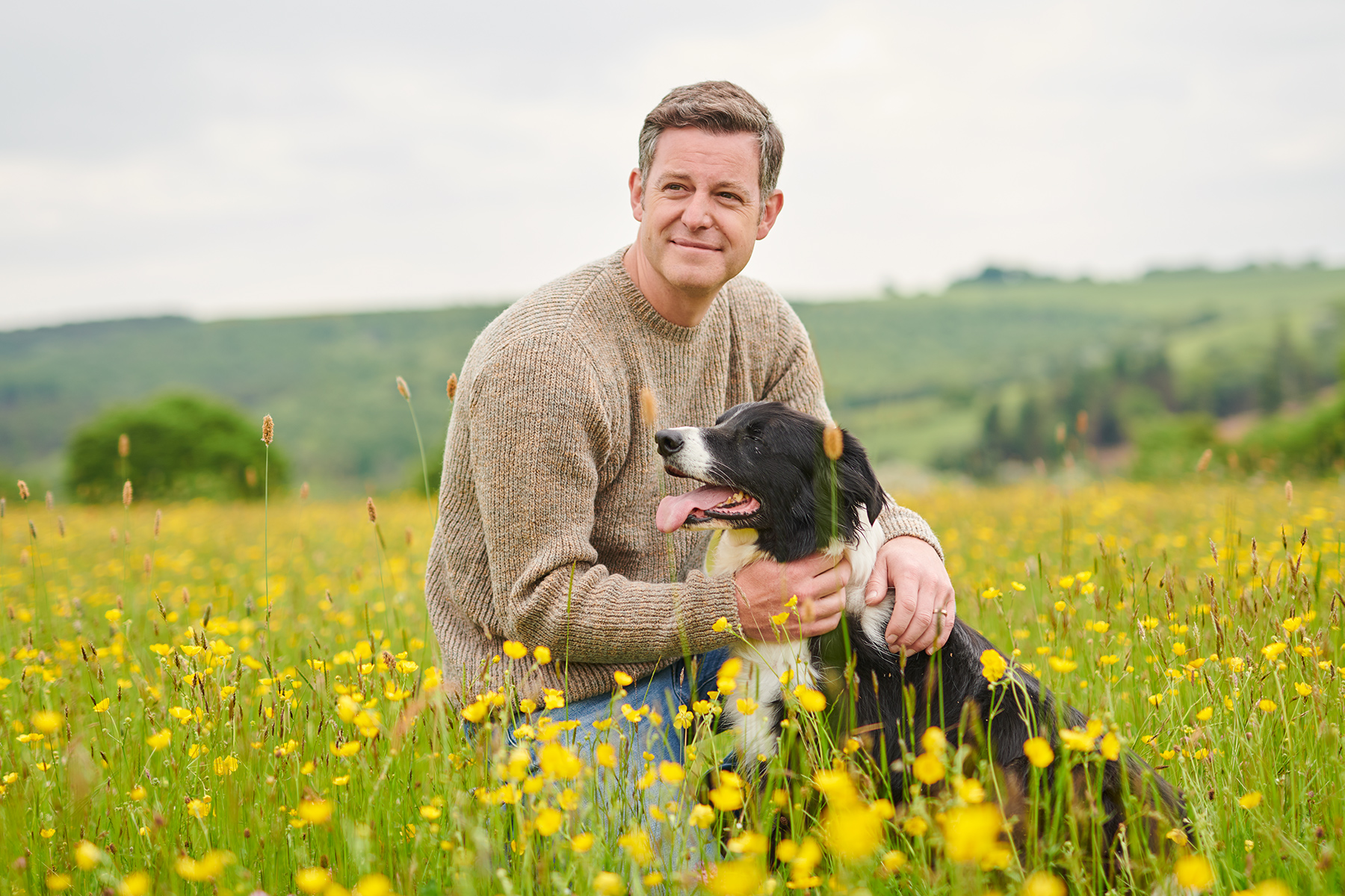 A photograph of Matt Baker, with his dog, at home on his fam. Image: Penguin