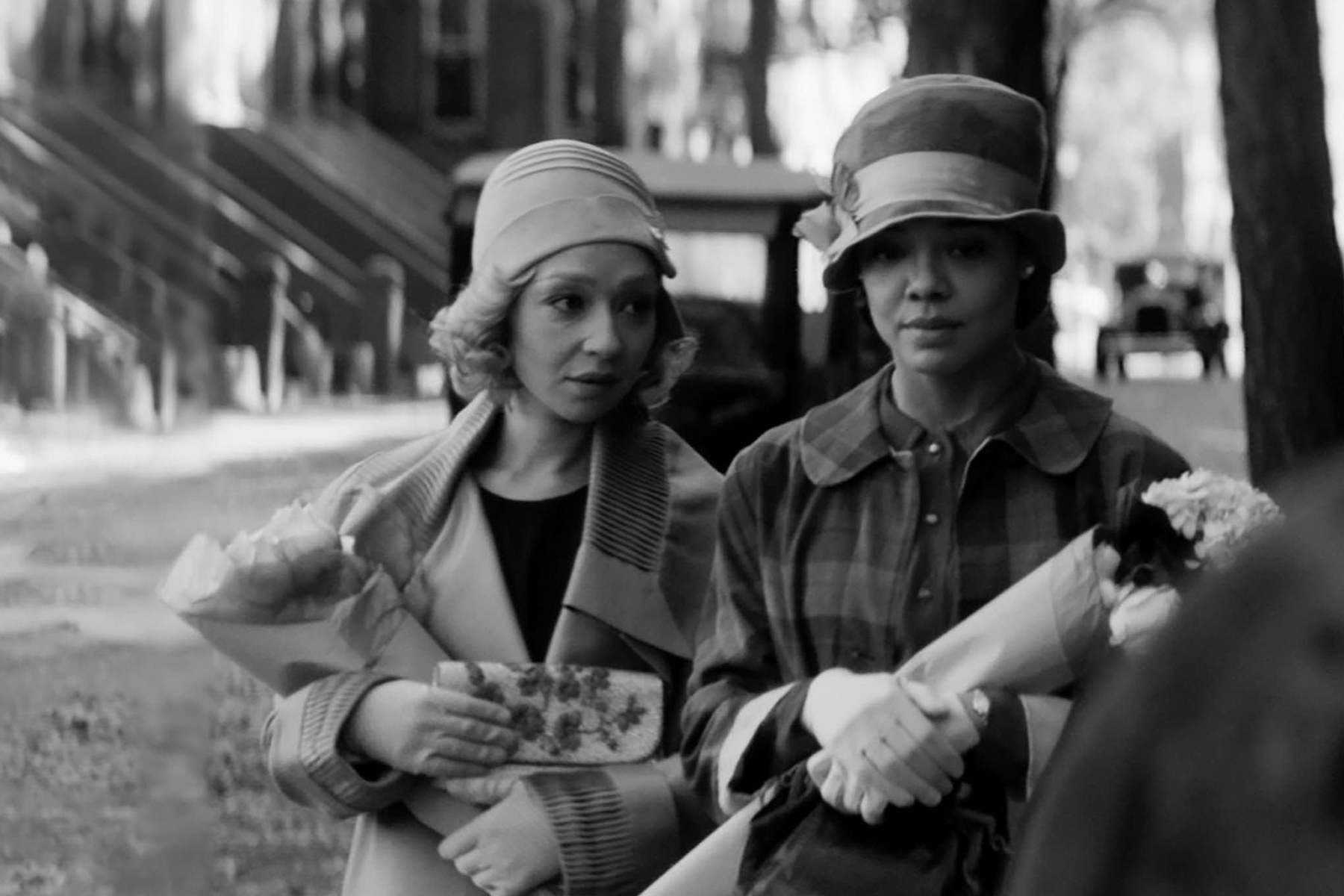 A photograph of Ruth Negga and Tessa Thompson in 1920s clothing in Passing