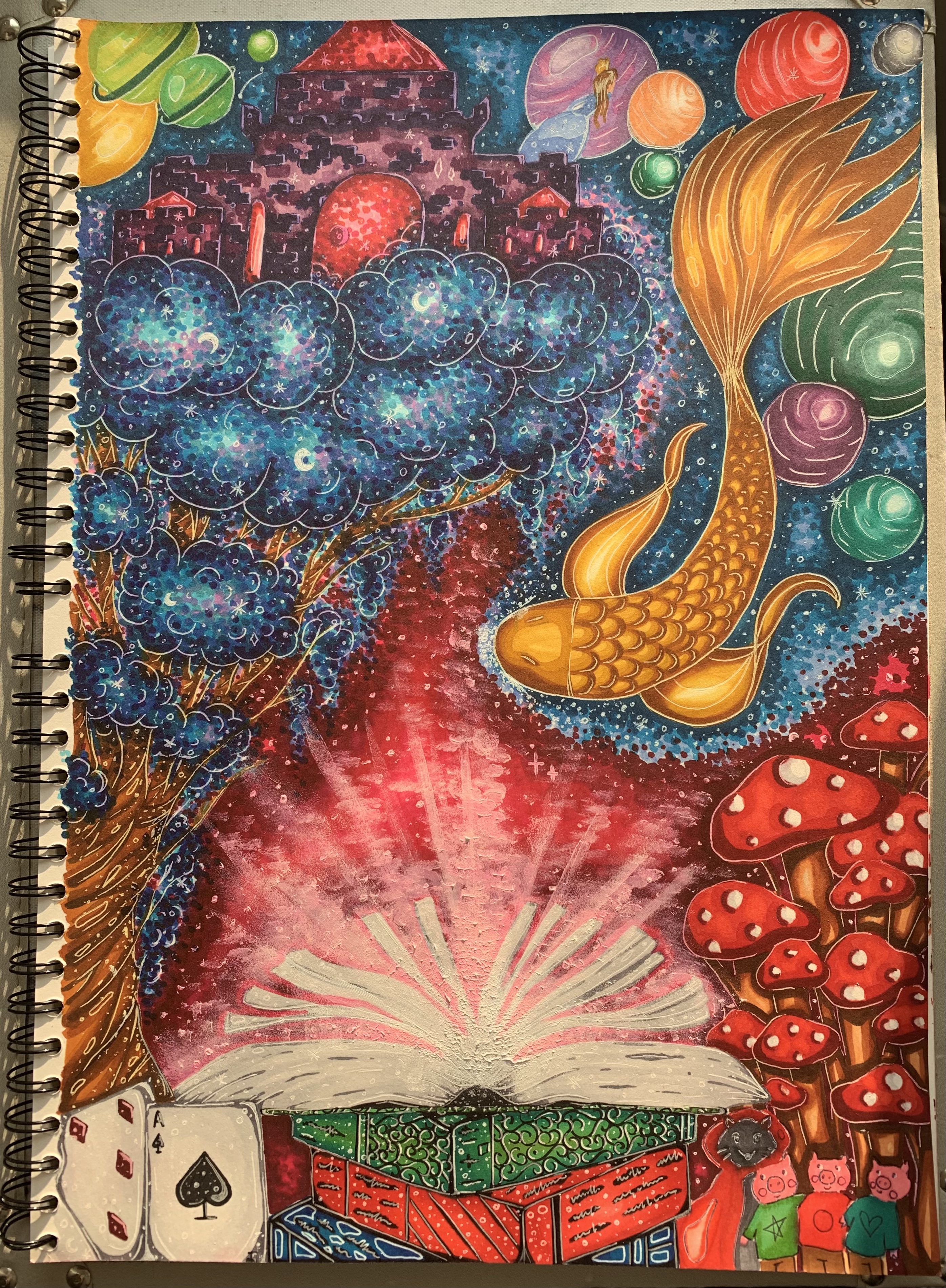 A photograph taken of a colourful painting in an A4 notebook. At the centre there is a book with the pages open with light shining from it. A golden fish swims down on the right, and there are toadstools and a deck of cards along the bottom of the page.