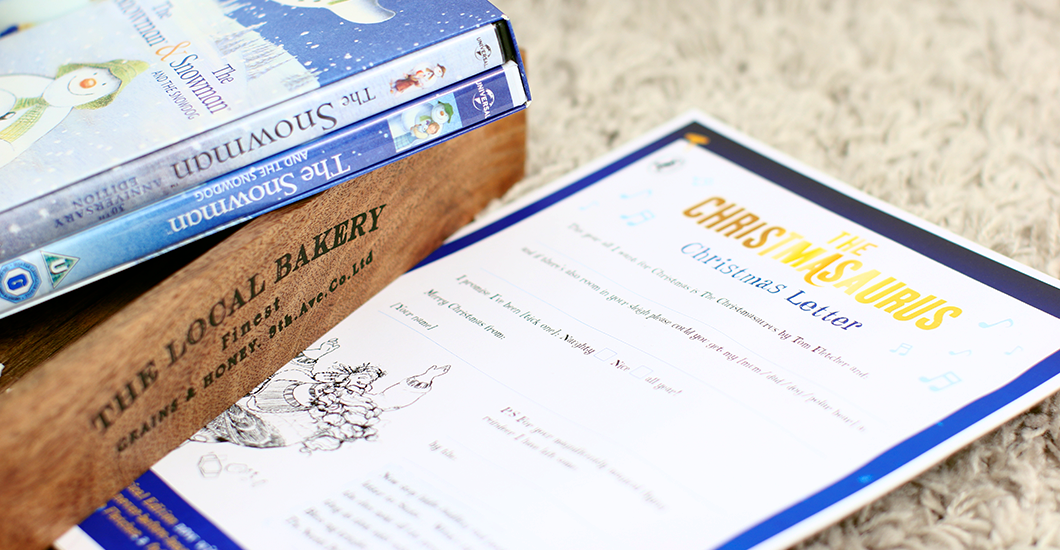 A photo of a copy of The Snowman DVD with a Christmasaurus letter template