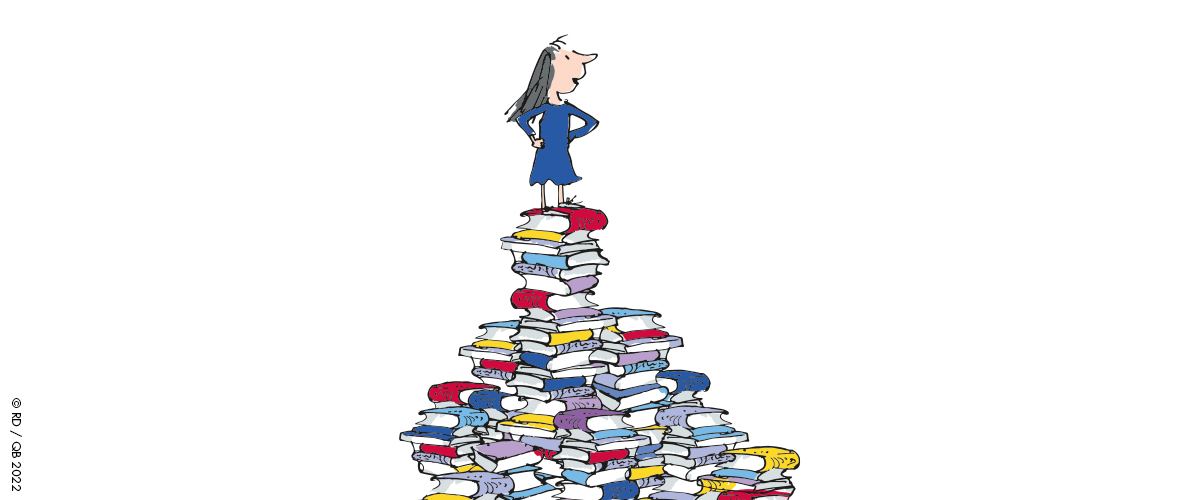An illustration by Quentin Blake of Matilda standing on top of a pile of books