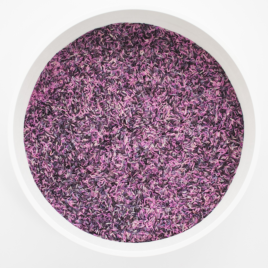A photo of a big white bowl filled with purple rice