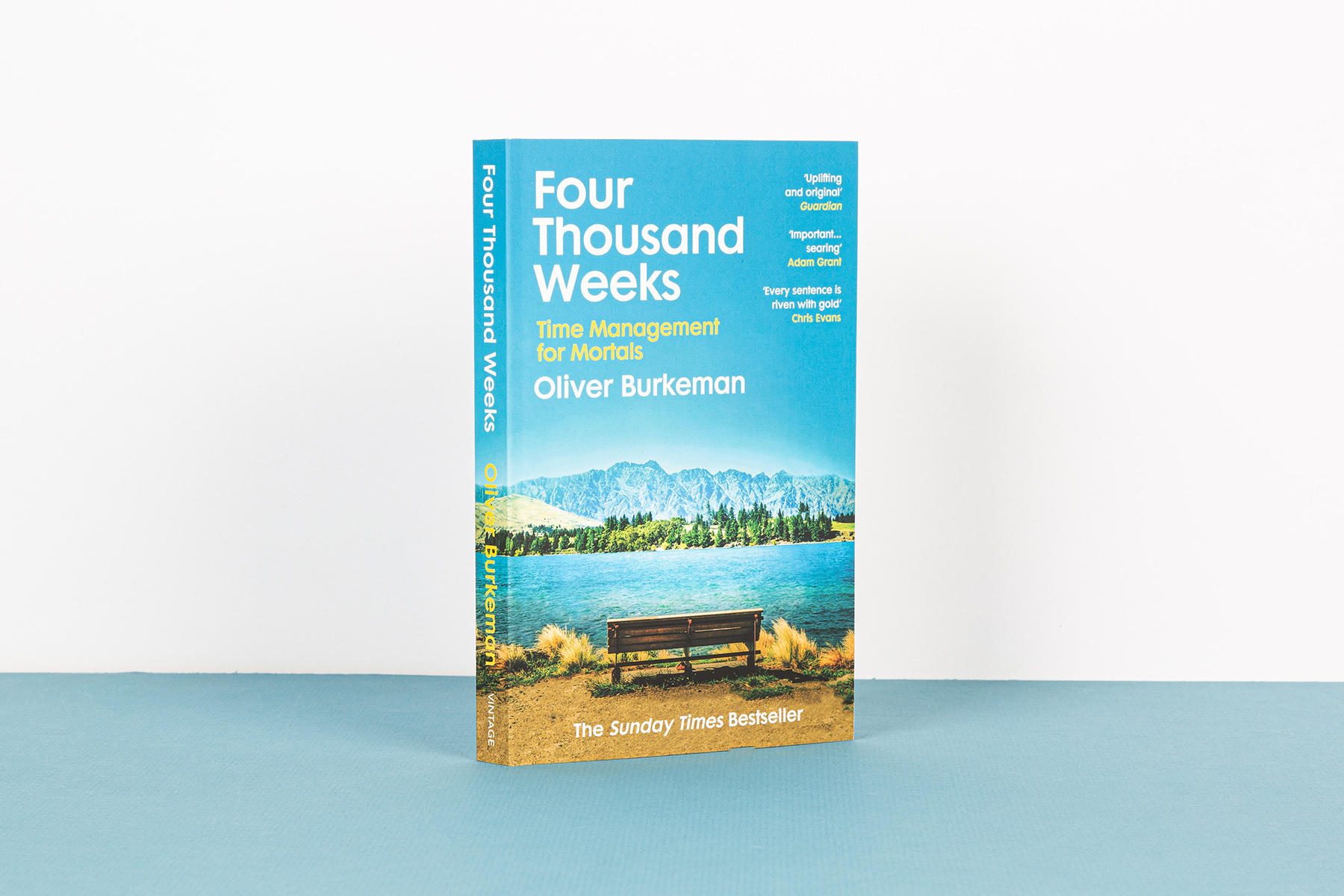 Four Thousand Weeks by Oliver Burkeman, standing upright against a blue and white background.