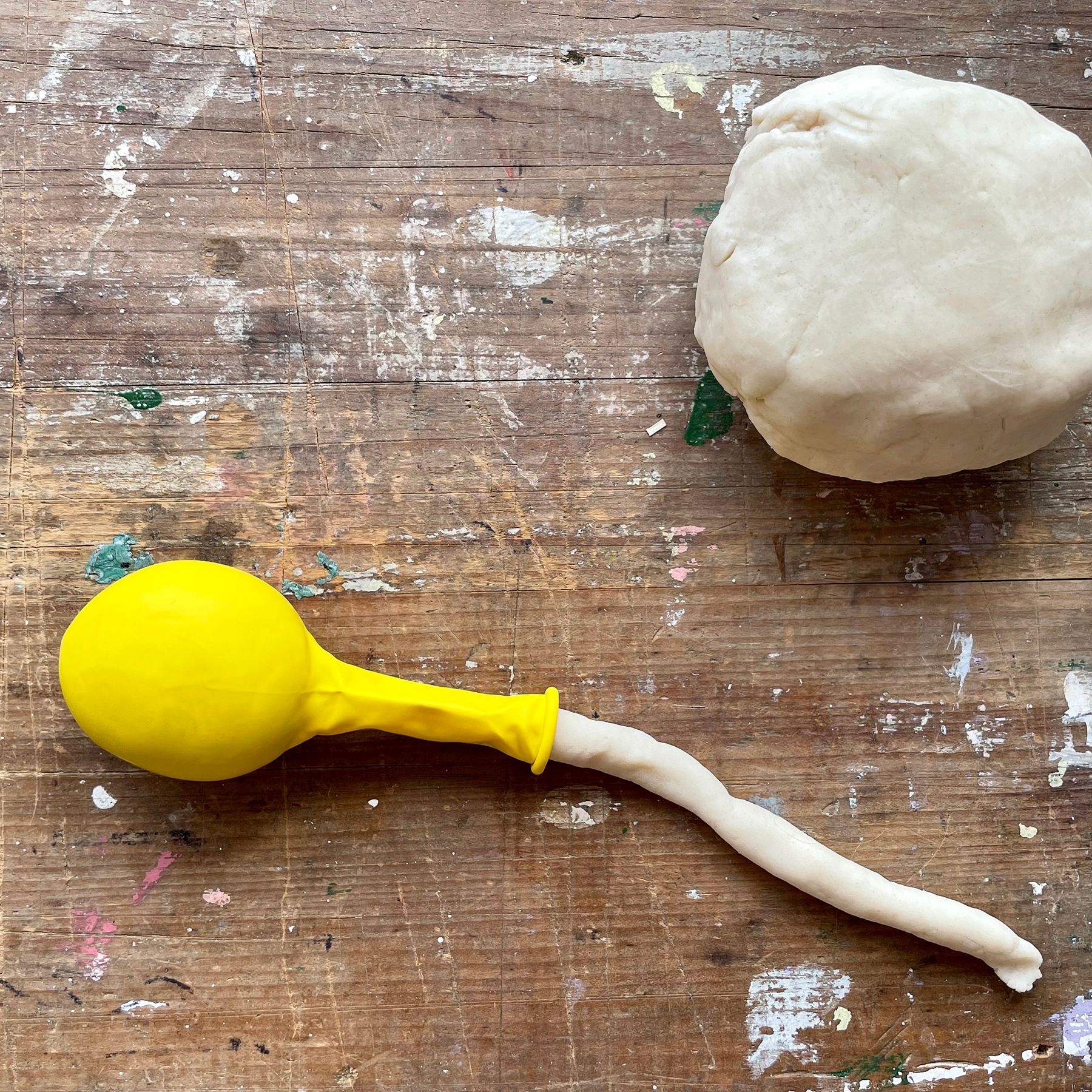 A photo of a balloon having the homemade dough fed into it