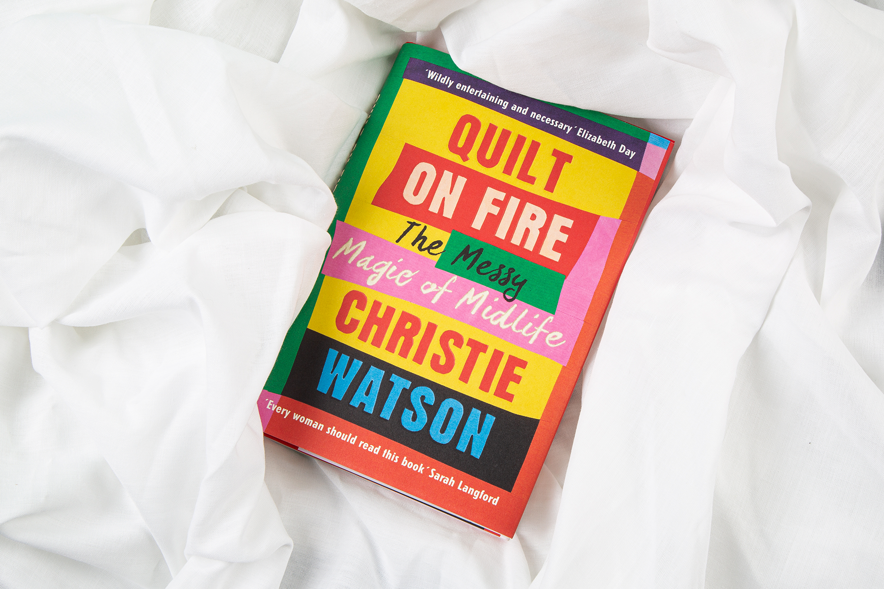 An image of Quilt on Fire on white bedsheets