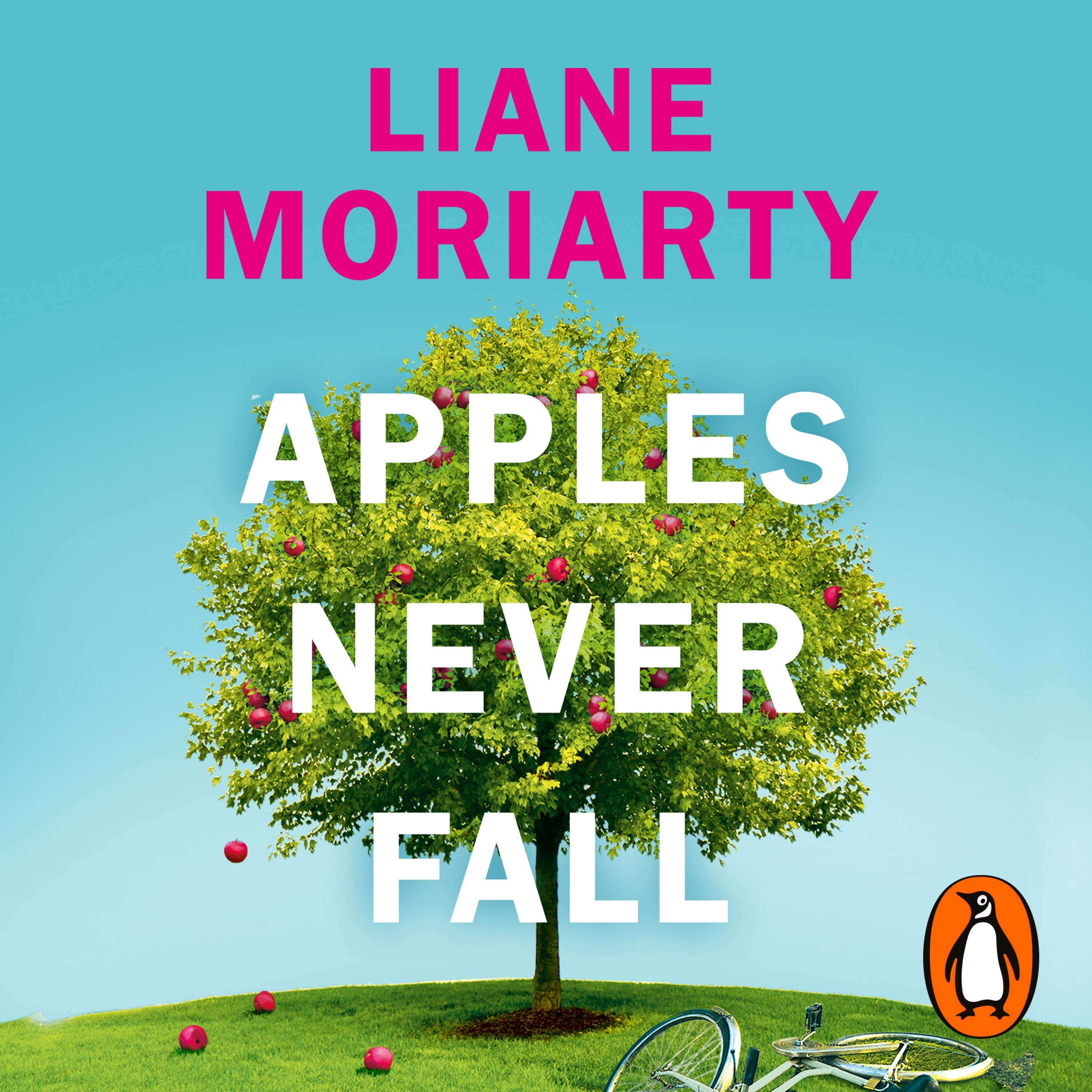 Cover of Apples Never Fall by Liane Moriarty. Red apples falling from an apple tree, against a blue sky. In front of the tree a bicycle is lying on the grass. The author's name is in pink at the top, and the title is in white across the centre of the tree.