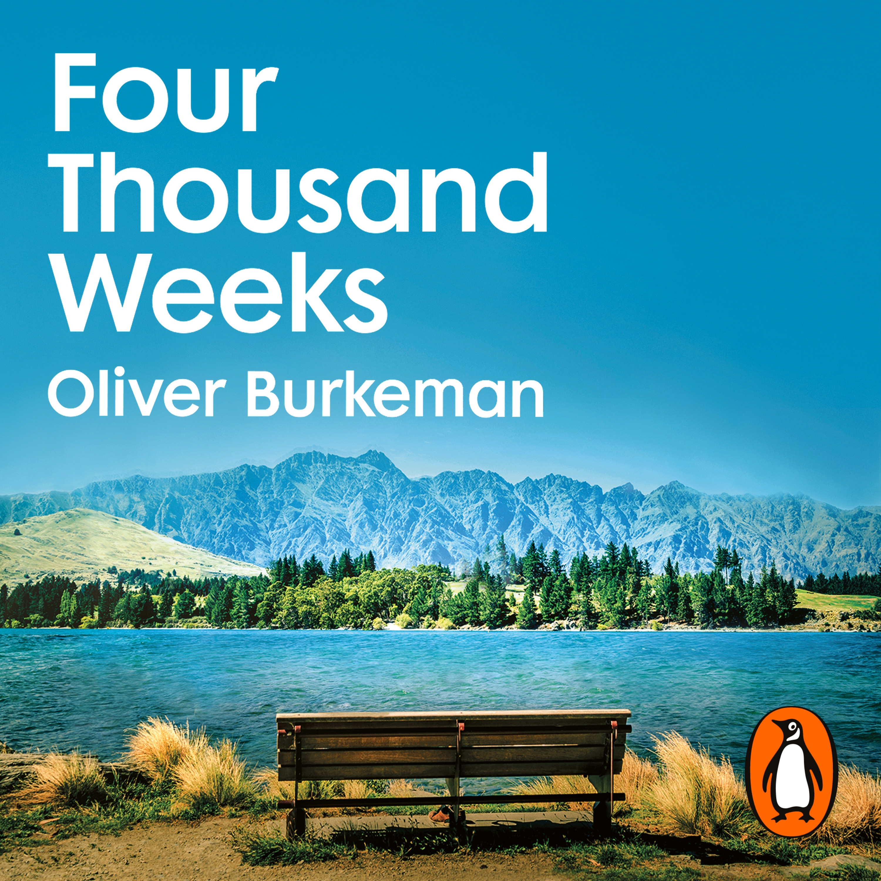 Audiobook image for Four Thousand Weeks: a landscape view with mountains in the background, a lake, and a bench in the foreground. The title and author name are in white at the top.