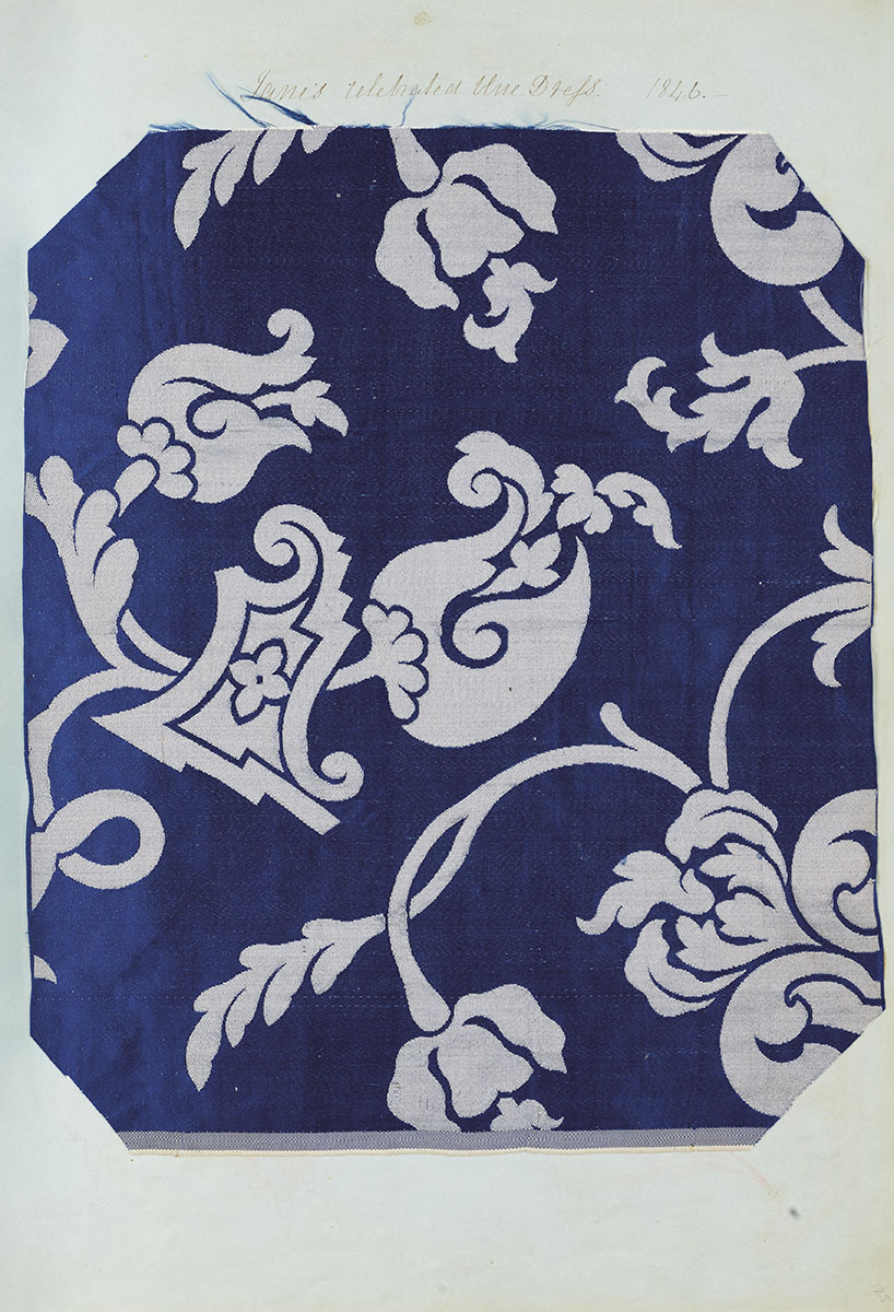 Blue and white fabric swatch with floral pattern.