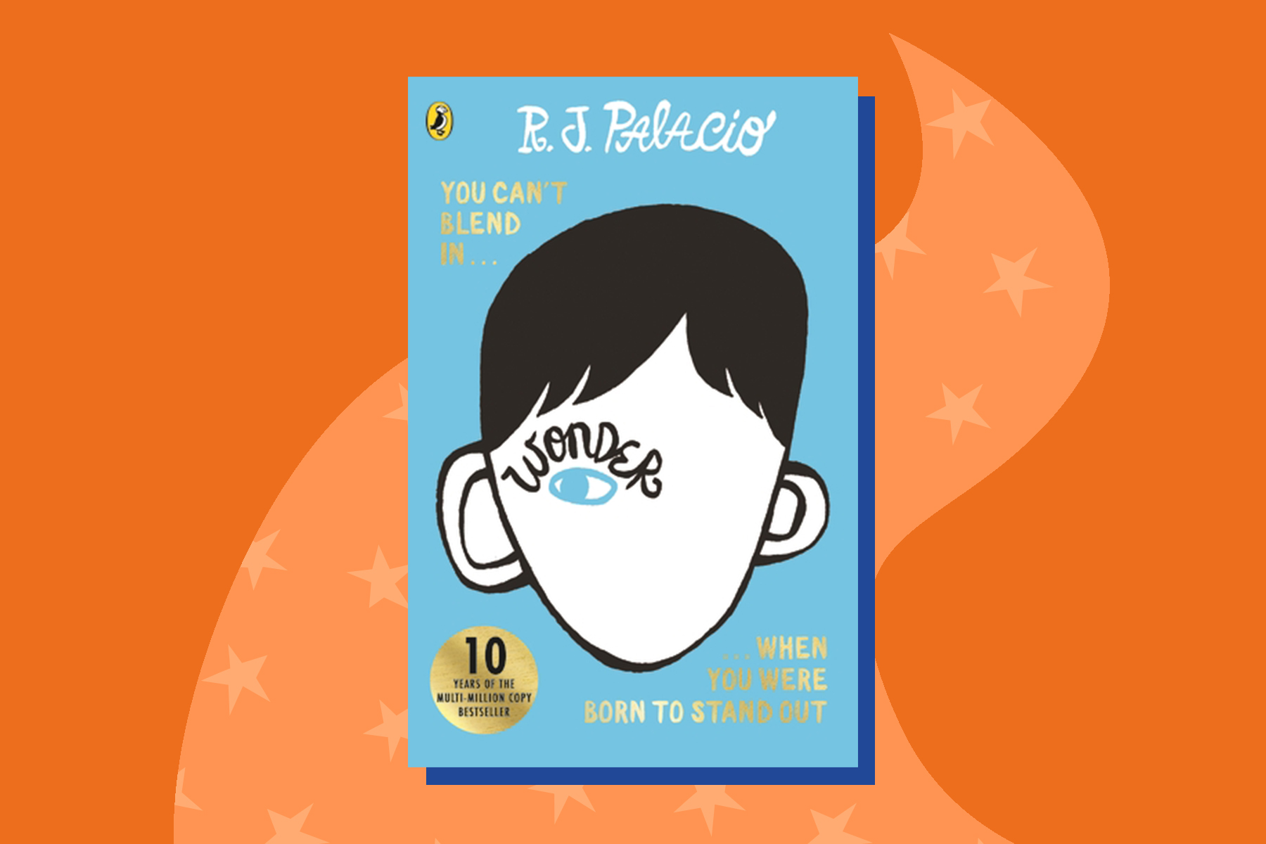 An image of the book Wonder by R J Palacio on an orange background with a shape coming out of the bottom filled with stars.