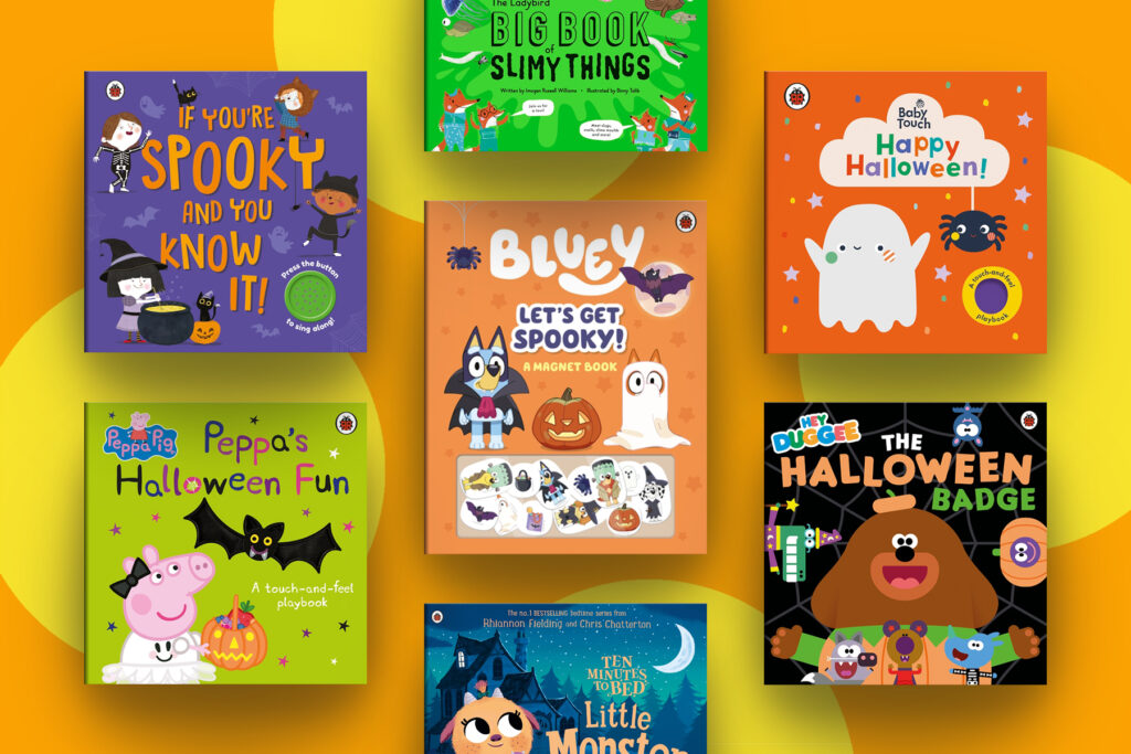 A selection of Halloween-themed books for little children on an orange background with yellow spots.