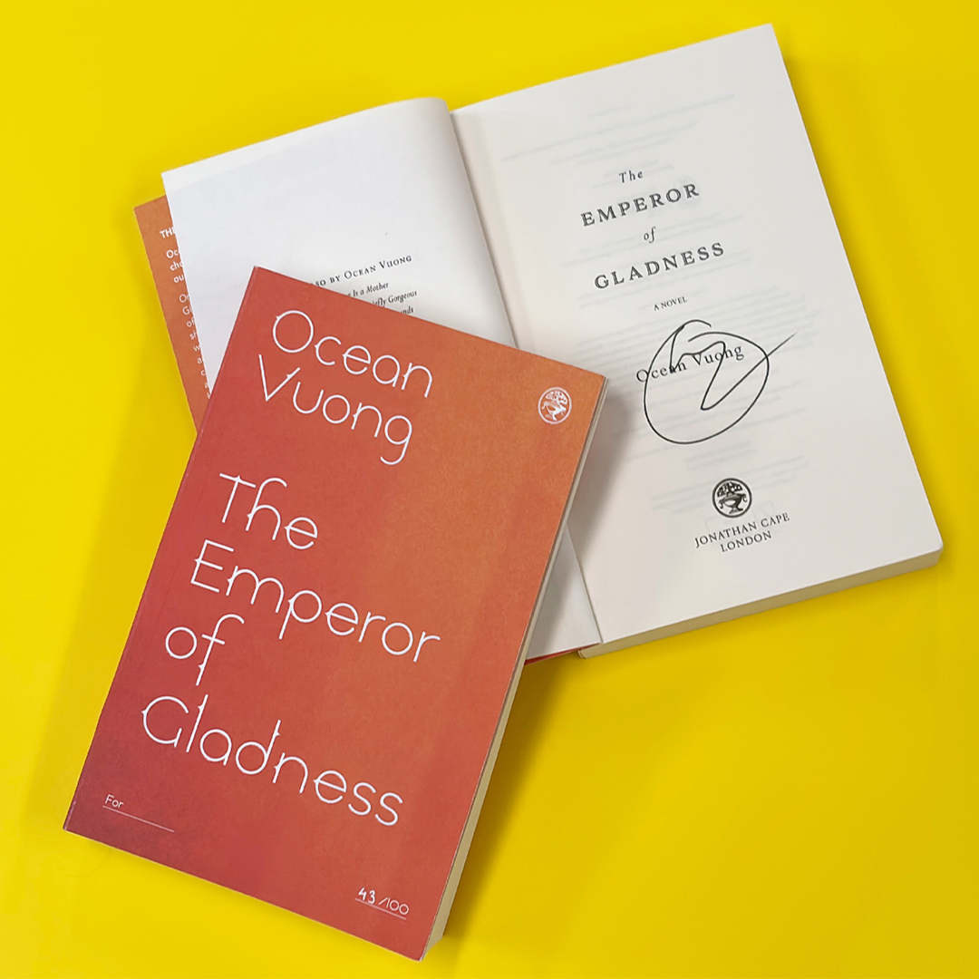 An image of an orange numbered proof of The Emperor of Gladness, and one open to display Ocean Vuong's signature, on a yellow background